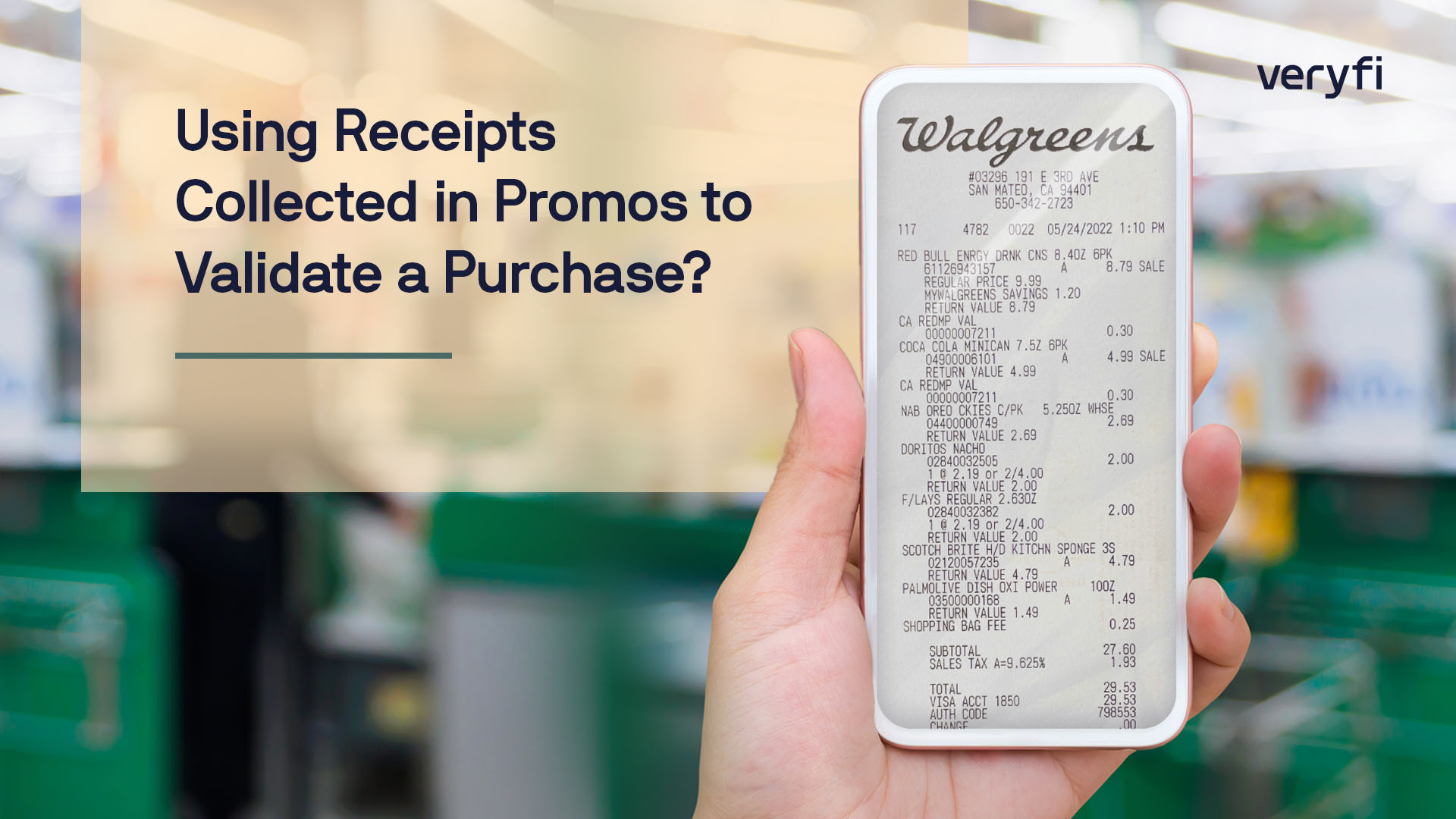 A hand holding a mobile phone with a Walgreens receipts on it.